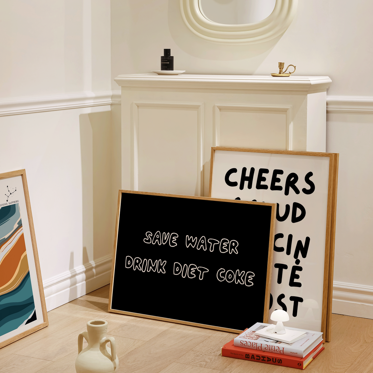 Decorative items including a blackboard, framed text, and a vase on a wooden floor.