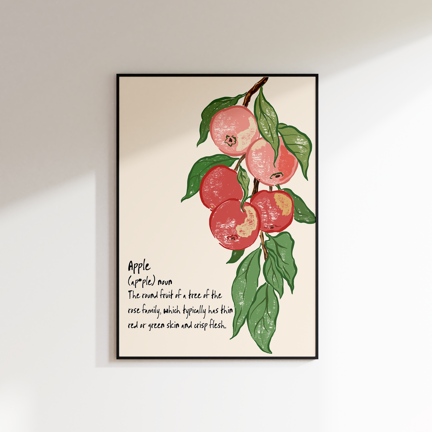 Framed artwork of apples on a beige background with text