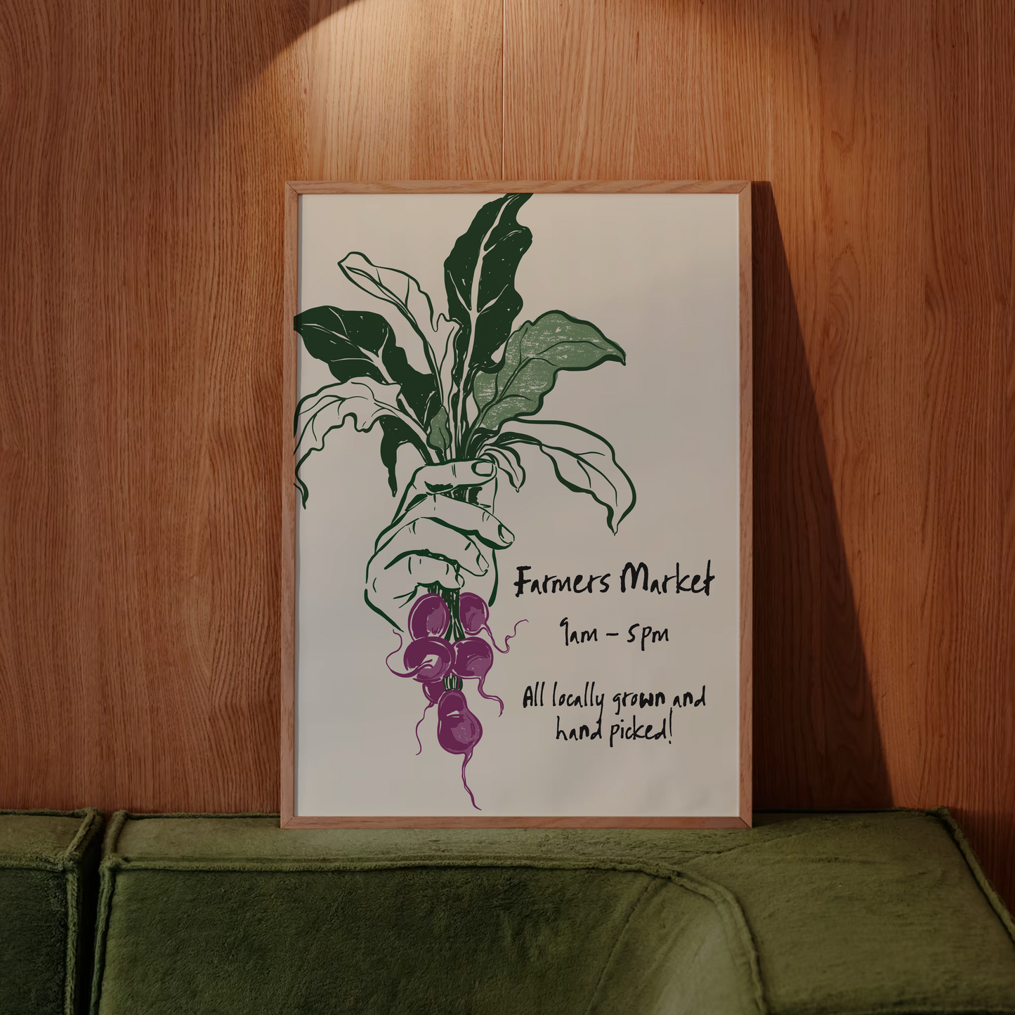 Framed artwork of a hand holding vegetables against a wooden wall.