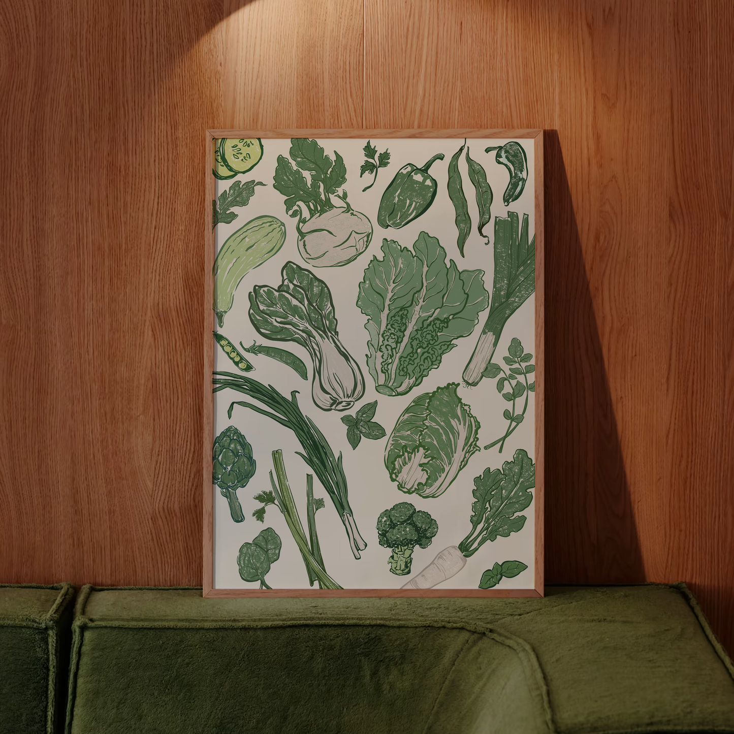 Decorative kitchen towel with green vegetable pattern on a wooden wall