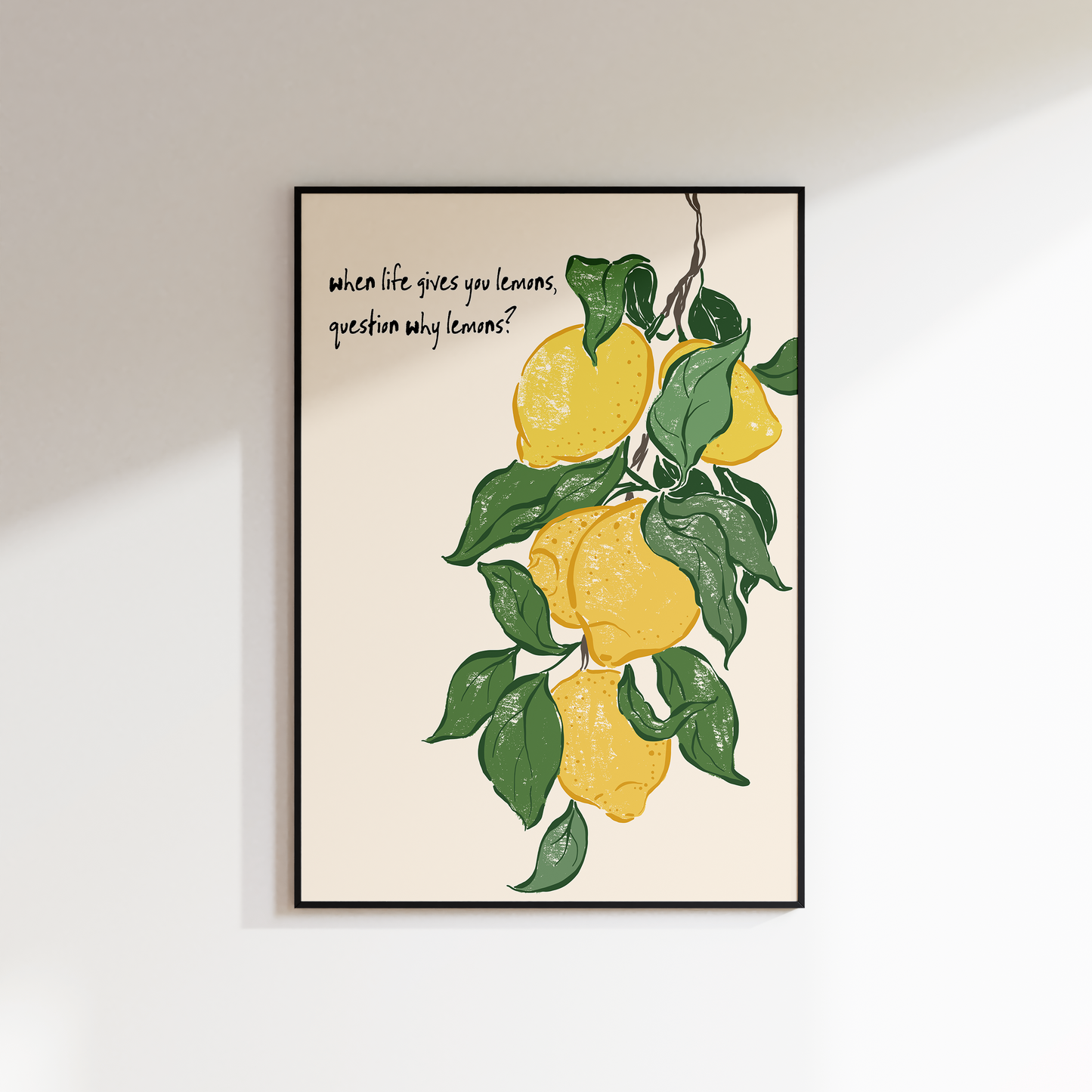 Framed artwork with lemons and text on a white wall
