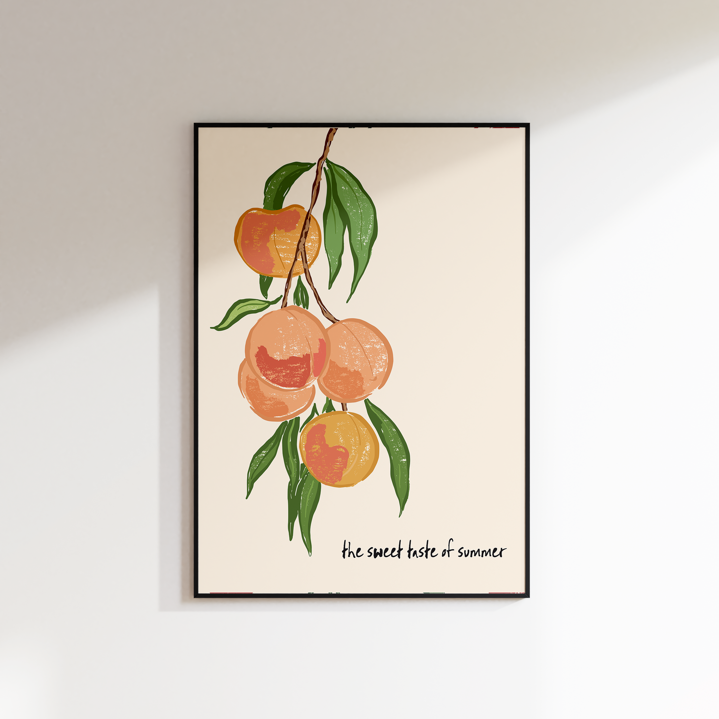Framed artwork of peaches on a beige background