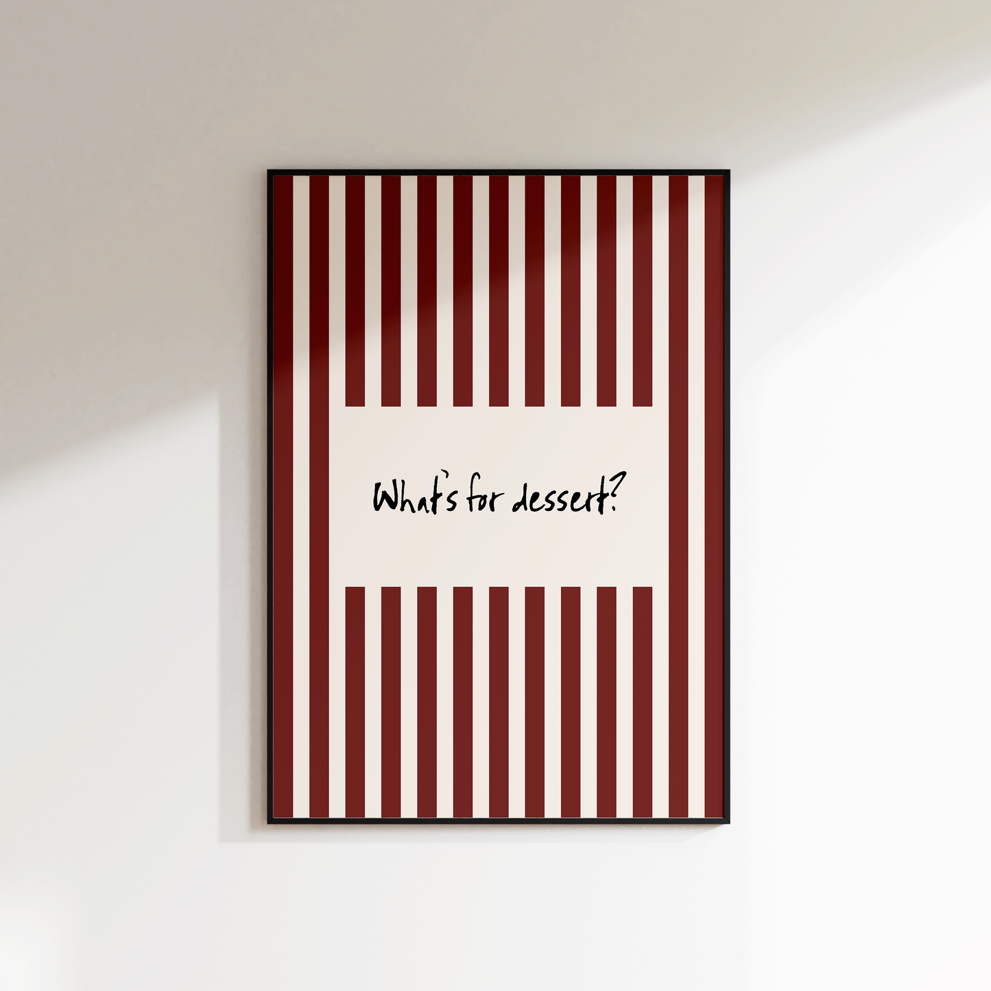 Framed artwork with red and white striped design and text on a white wall.