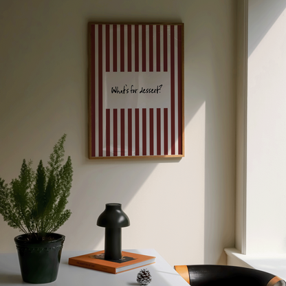 Room interior with a table, chair, and framed picture on the wall.