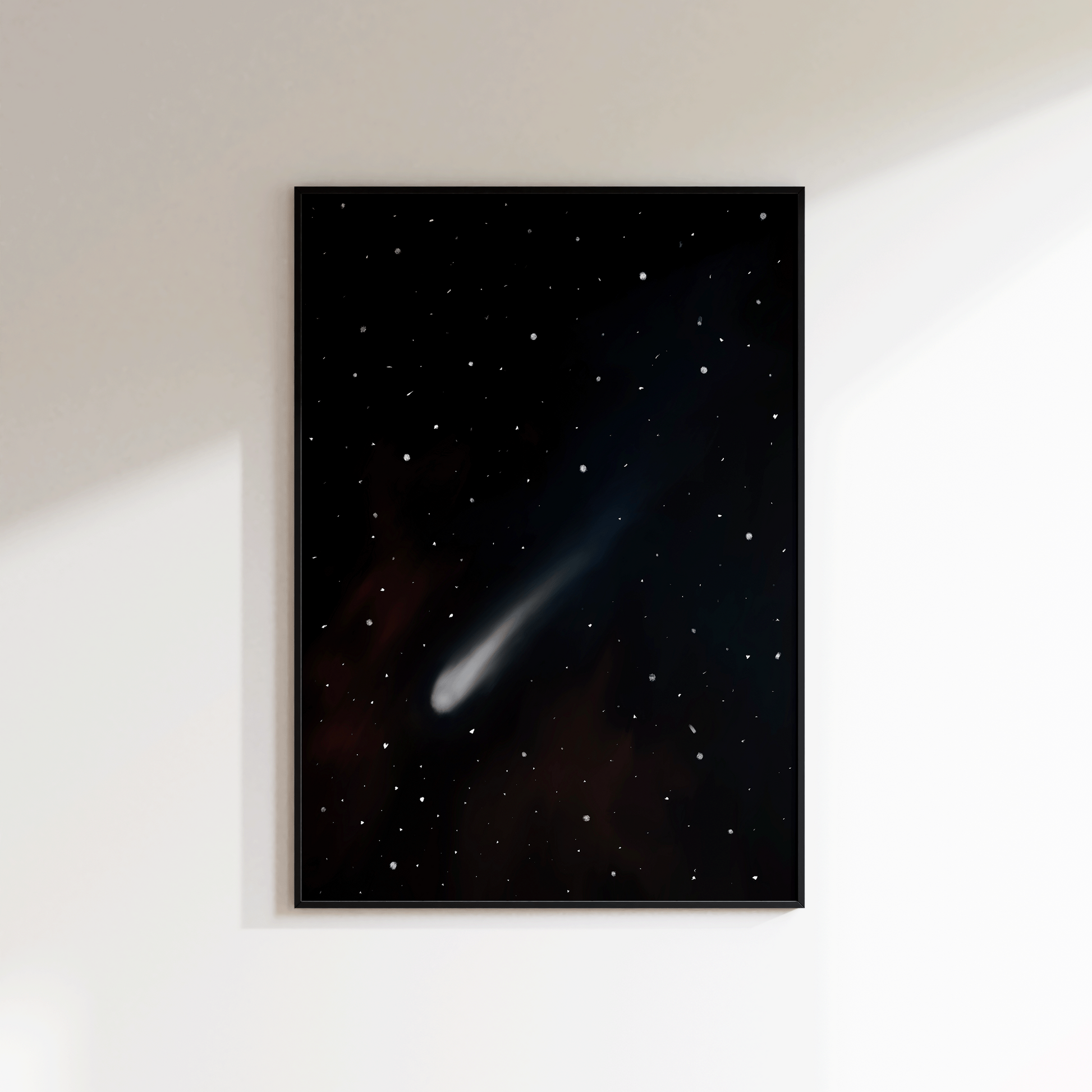 Framed artwork of a comet in space on a white wall