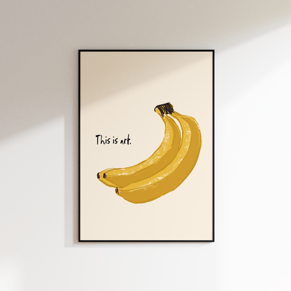 Framed artwork of bananas with text on a beige background