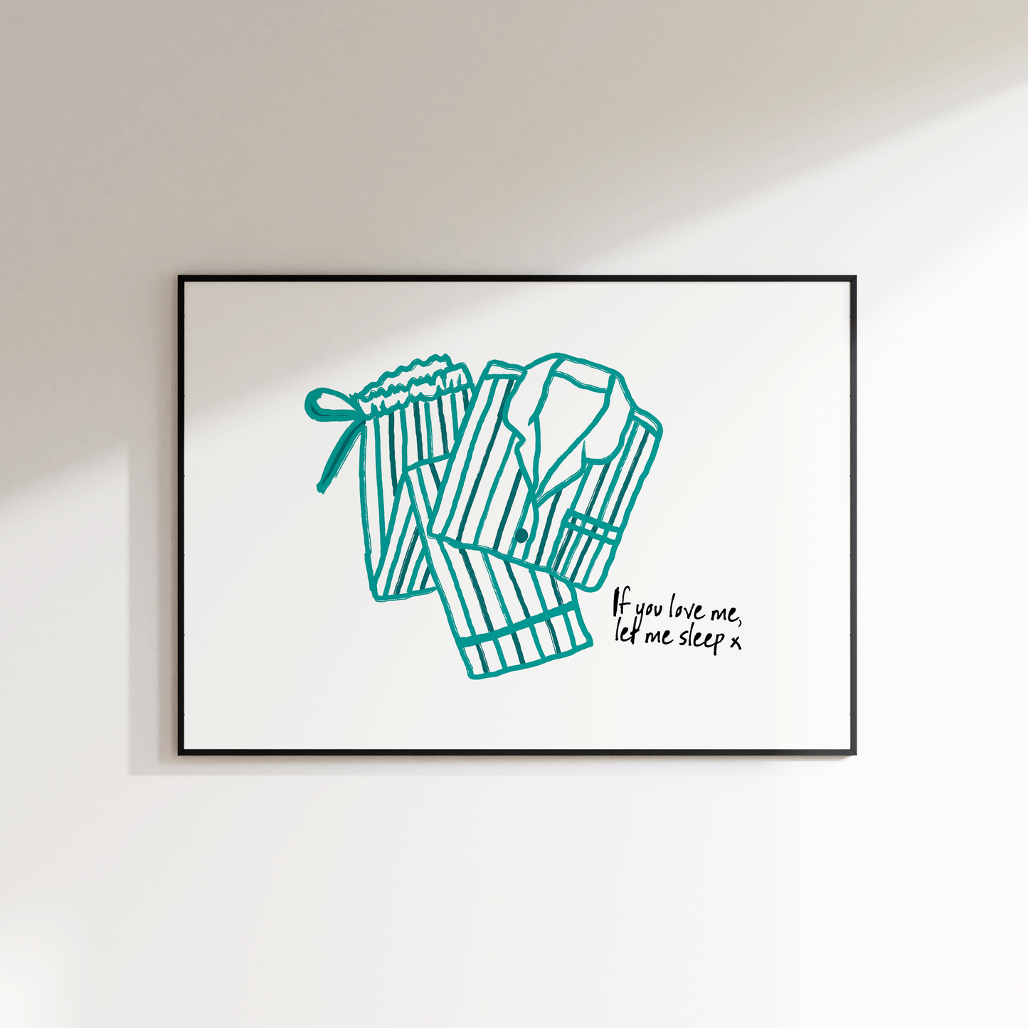 Framed artwork of a robe with text on a white wall