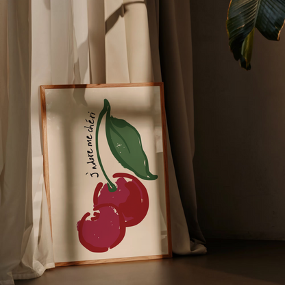 Decorative pillow with cherry design against a neutral background