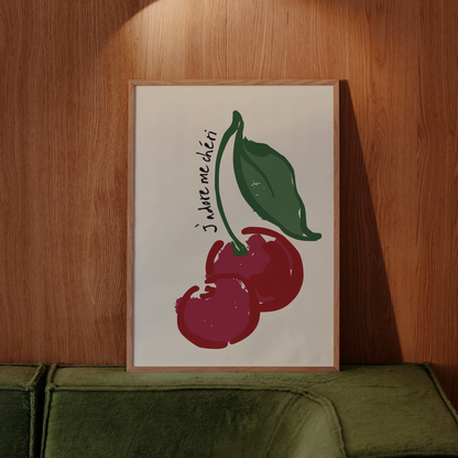 Poster with cherry design and text on a wooden wall above a green sofa