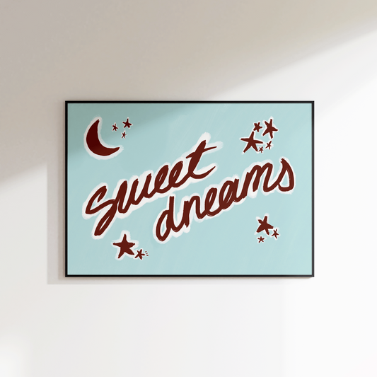Framed artwork with 'Sweet Dreams' text on a light blue background