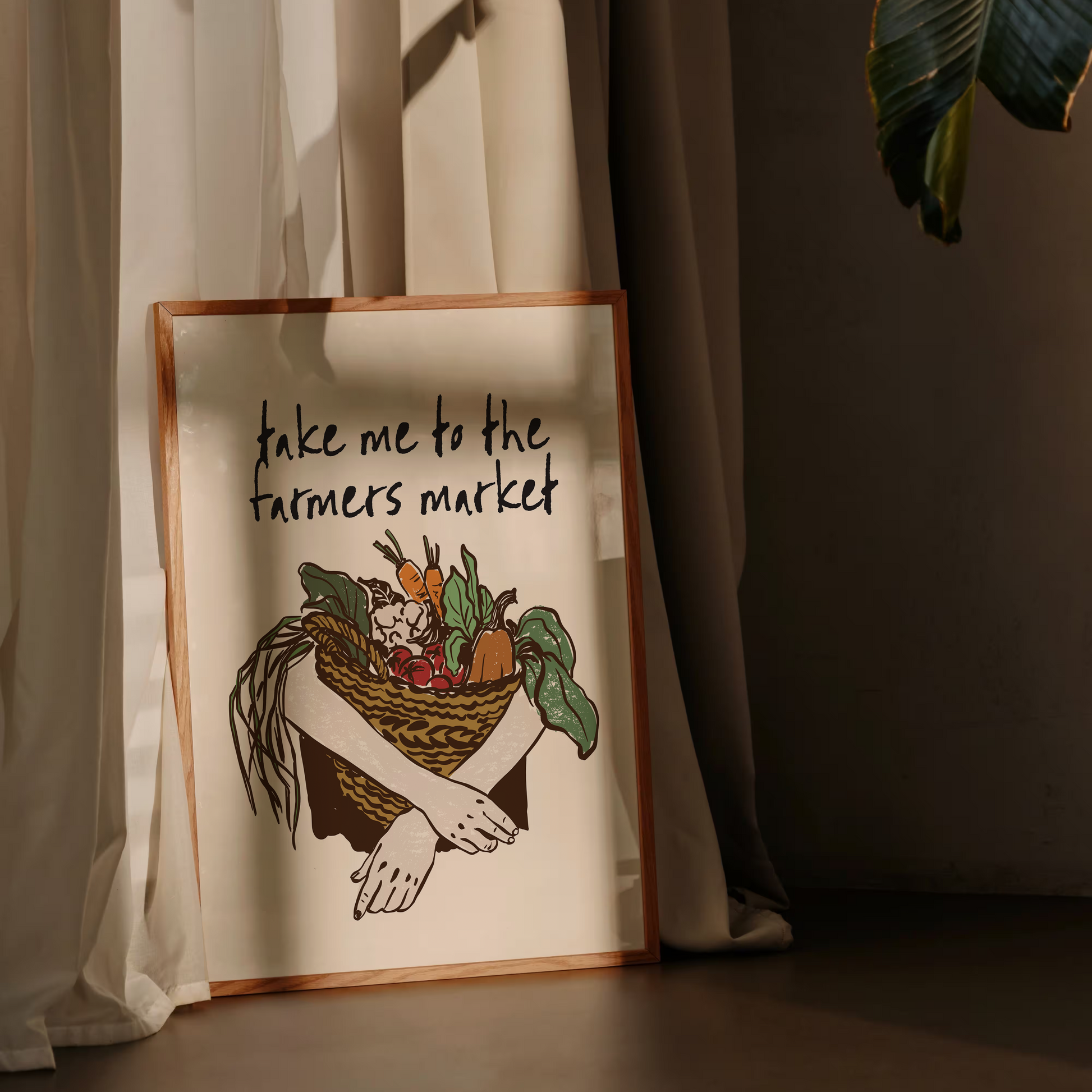 Decorative sign with illustration and text 'Take me to the farmers market' against a curtain backdrop