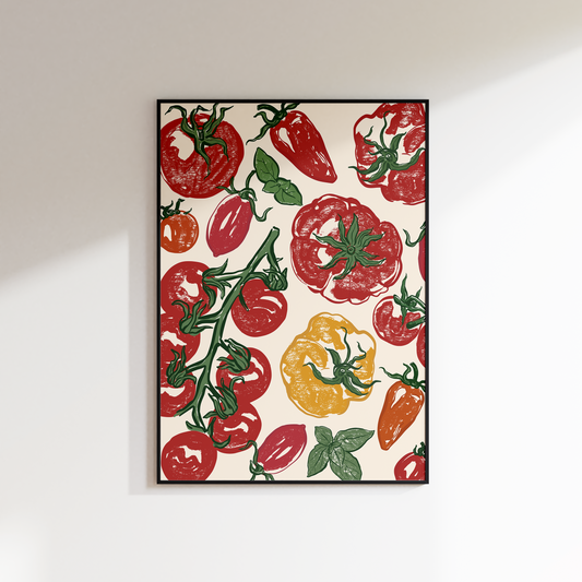Framed artwork with a colorful tomato and pepper pattern on a white wall.