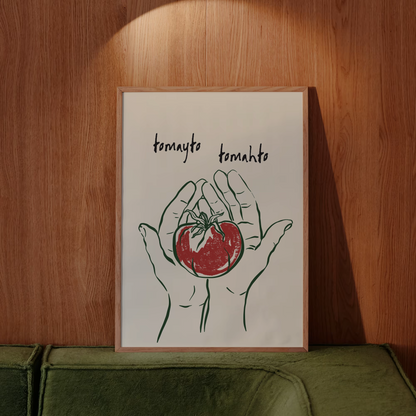 Framed artwork of hands holding a tomato against a wooden wall.