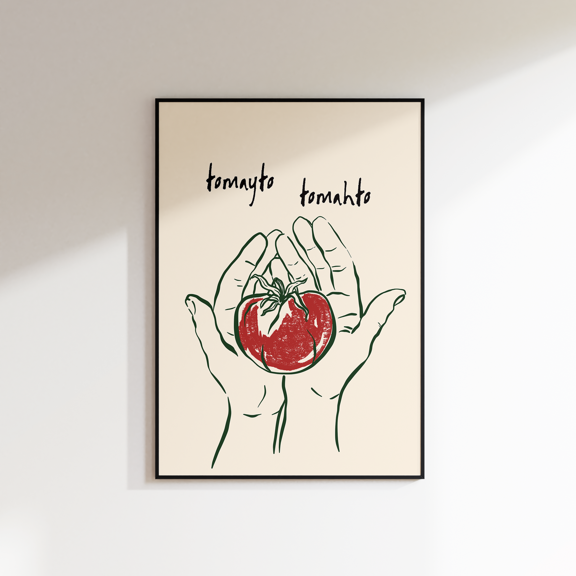 Framed artwork of hands holding a tomato with 'tomato tenchito' text on a beige background.