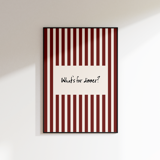 Framed artwork with red and white striped design and text on a white wall.